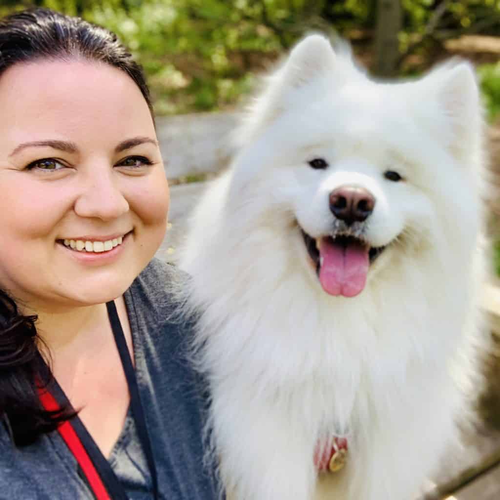 Emma Griffiths Voiceover smiling with her fluffy white dog